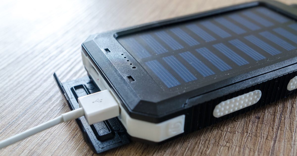 a power bank on a desk with a charging cable plugged into it